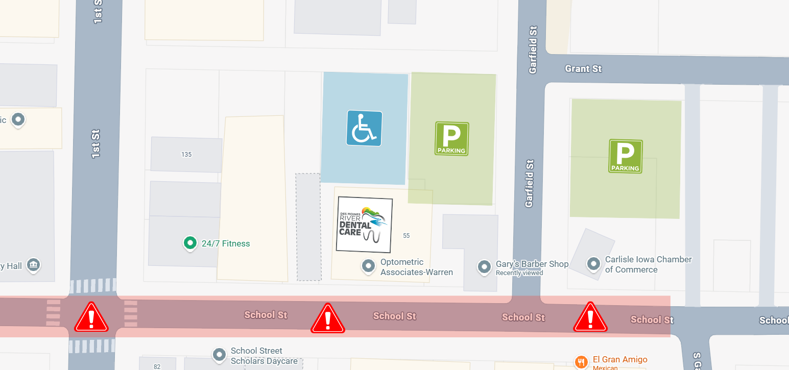 School street construction is highlighted with warning icons, while the parking lot directly behind the des moines river dental build is highlighted in blue with a handicap icon. Two parking lots to either side of Garfield St are highlighted in green with a public parking icon